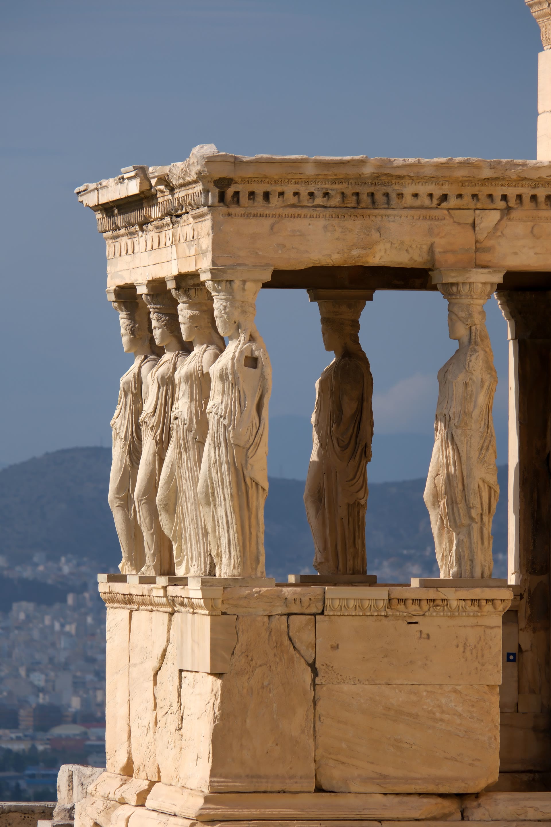 The Porch of the Caryatids on the Erechtheion, six women bearing the weight of the temple